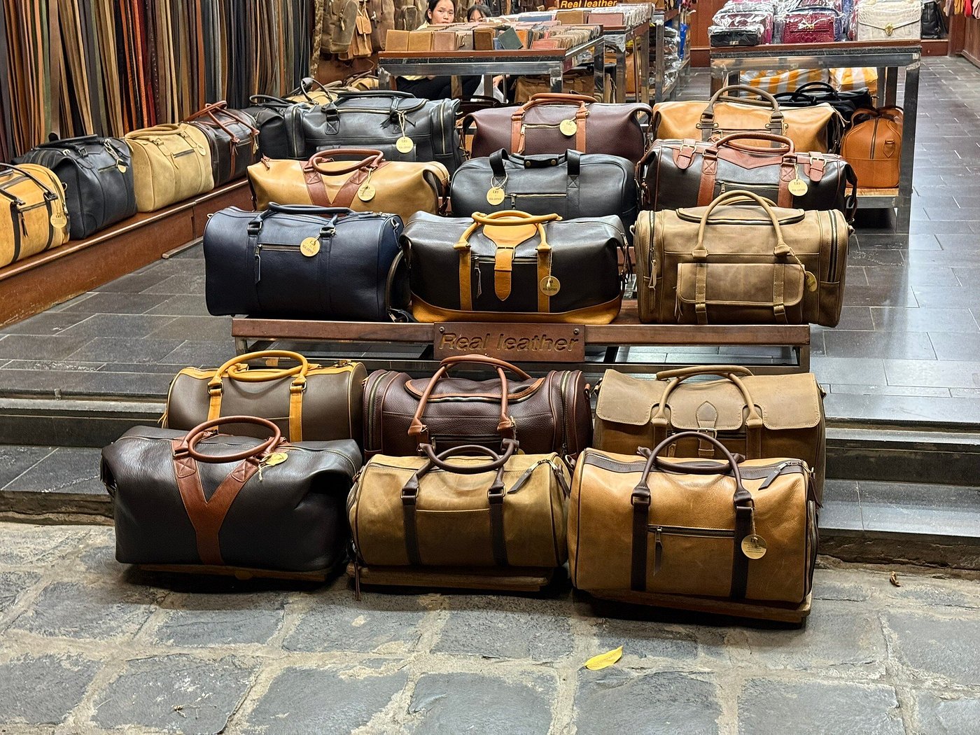 A new and aged Hinleath leather bag showing natural patina